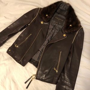 Louis Vuitton leather jacket with fur collar.